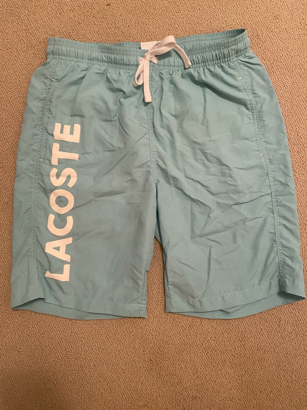 Lacoste Aqua Blue Swim Trunks with White Mesh Lining